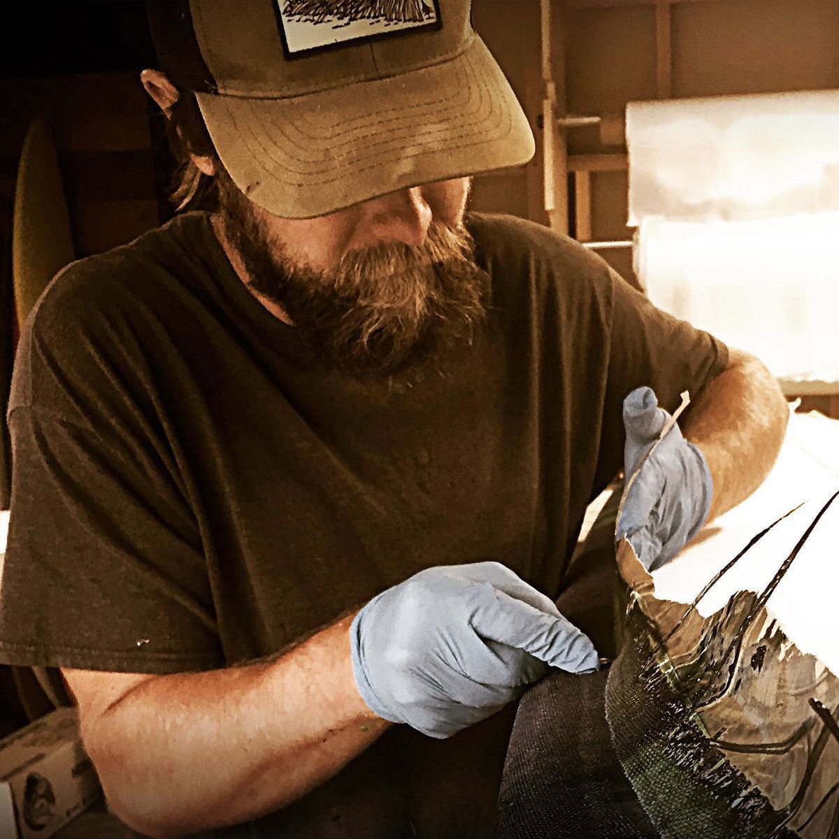 Man glassing a foilboard
